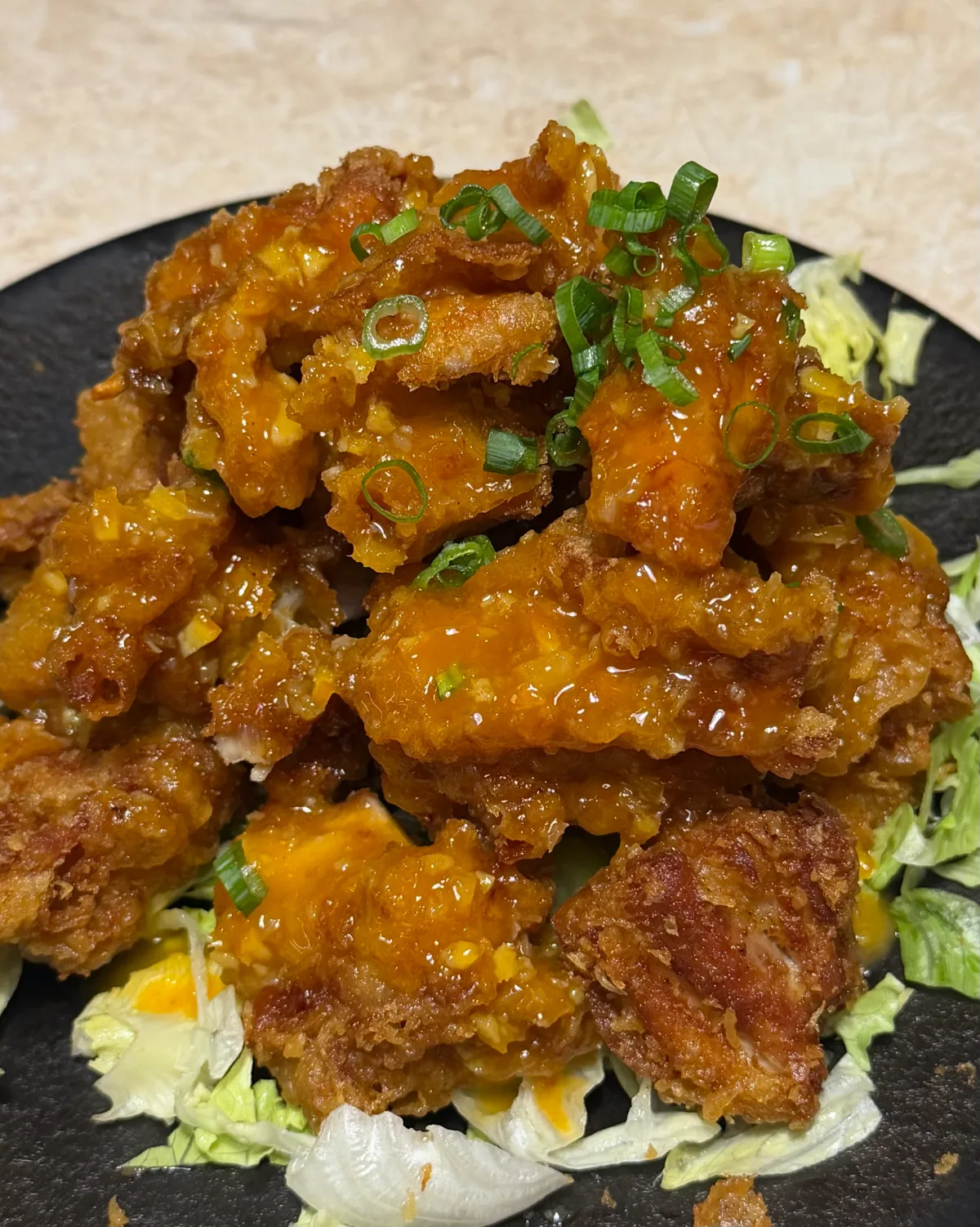 ねぎをのせたオレンジチキン