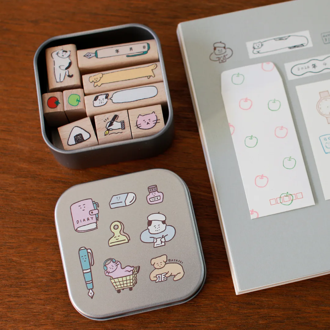 缶入りスタンプと紙に押した絵柄